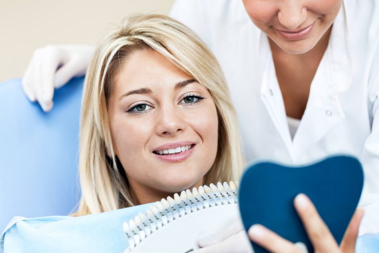 A comfortable patient speaking with the dentist before treatment.